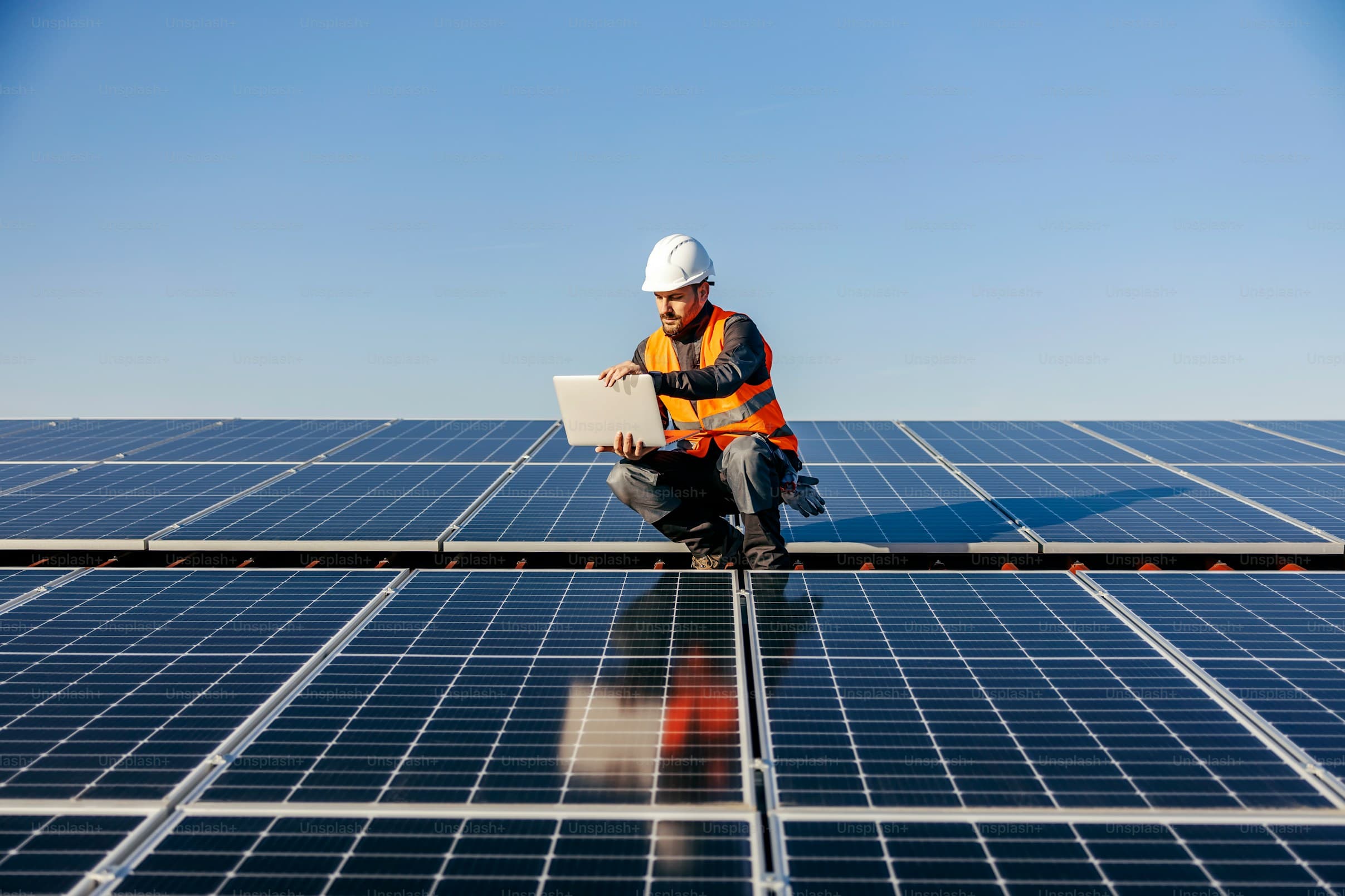 Engineer inspecting solar panels